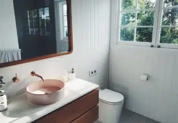 white ceramic sink with stainless steel faucet